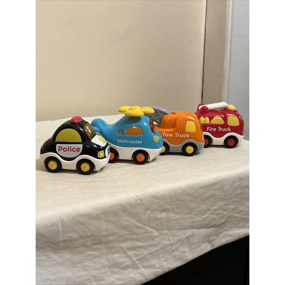 VTech Go! Go! Smart Wheels Lot of 4 Police Fire Tow Helicopter Toys